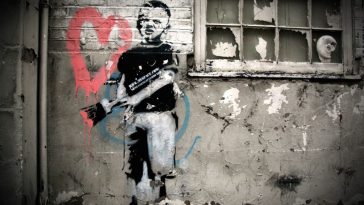 Banksy (British, 1974) Heart Boy, 2009.  Measurements: 87 in x 43 in x 18 in (220 cm x 110 cm x 45 cm).  Materials: Black aerosol stencil, pink acrylic on concrete and white-washed brick.Weight: 2000 kg (PRNewsFoto/Moco Museum Amsterdam)