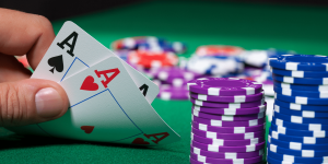 Showing-Aces-in-Poker-game-poker-chips-around-the-table-and-cards